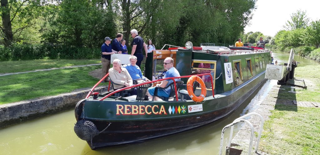 family group on rebecca canal boat going through lock