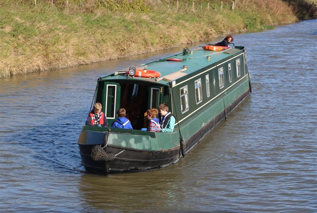 Youth on canal boat